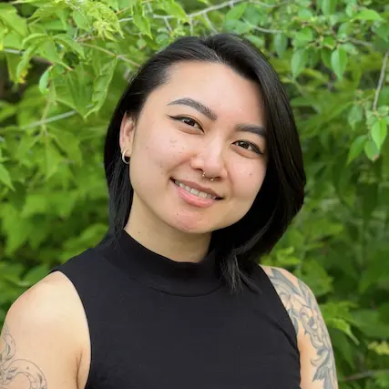 dr suki hon naturopathic doctor roncys apothecary and clinic headshot with foliage nature background cropped