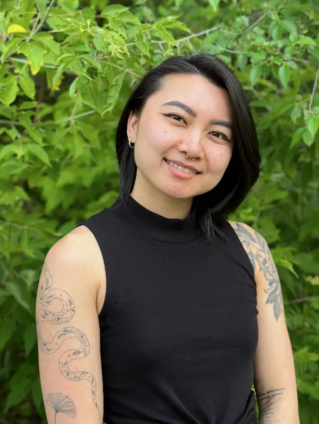 dr suki hon naturopathic doctor roncys apothecary and clinic headshot with foliage nature background