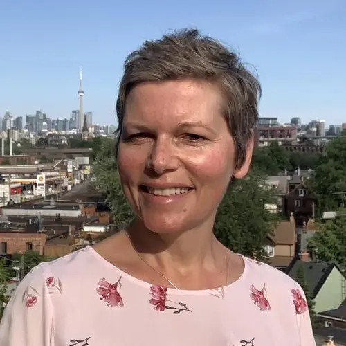 Joanna Rogowska massage therapist shiatsu reflexology headshot with city of toronto in background cropped