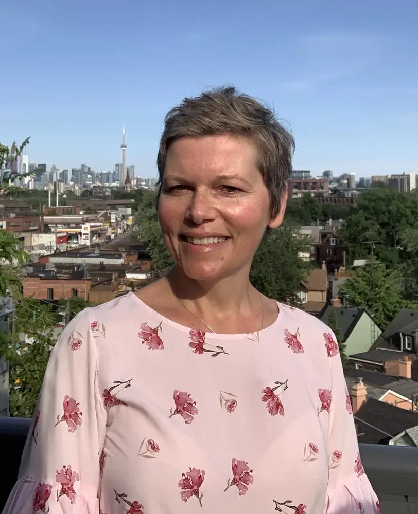 Joanna Rogowska massage therapist shiatsu reflexology headshot with city of toronto in background