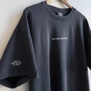 Roncys apothecary and clinic custom brand tshirt in acid black front with text nature made it first close up with sleeve detail