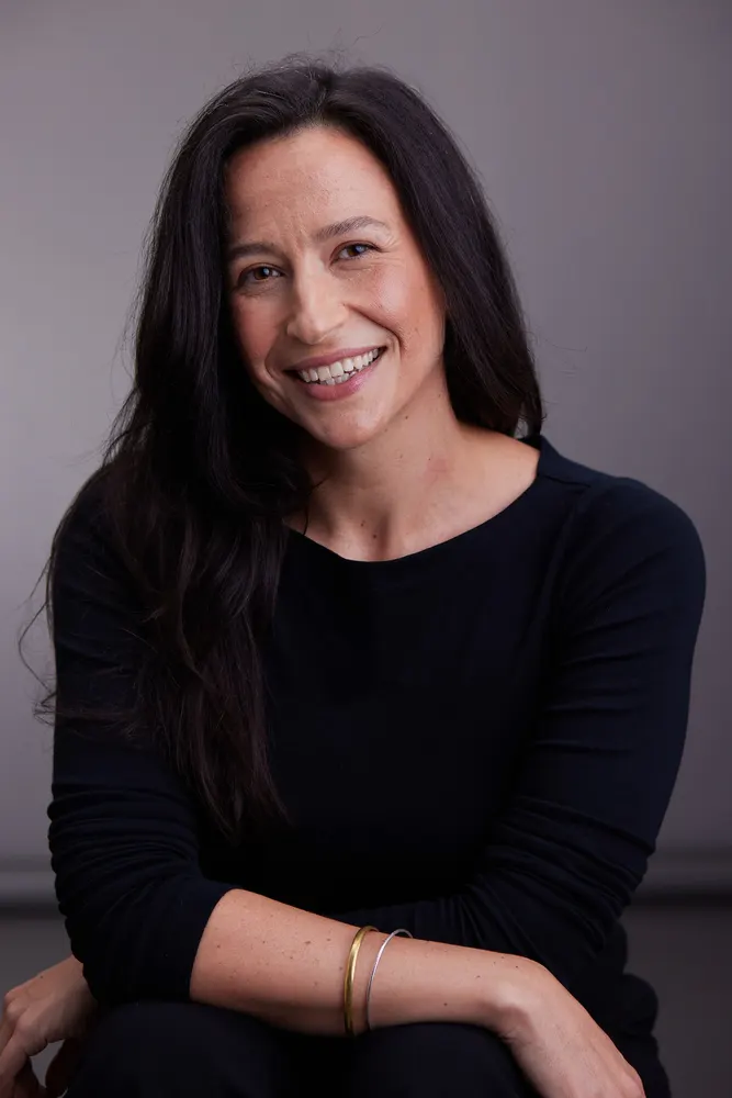 Lisa Moroni registered acupuncturist headshot against grey background