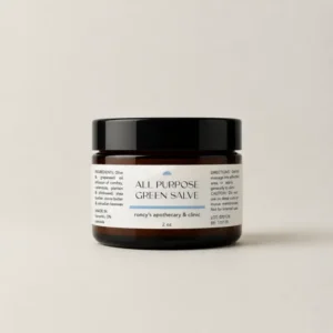 roncys-apothecary-and-clinic-2oz-amber-jar-all-purpose-healing-balm-green-salve-against-neutral-background